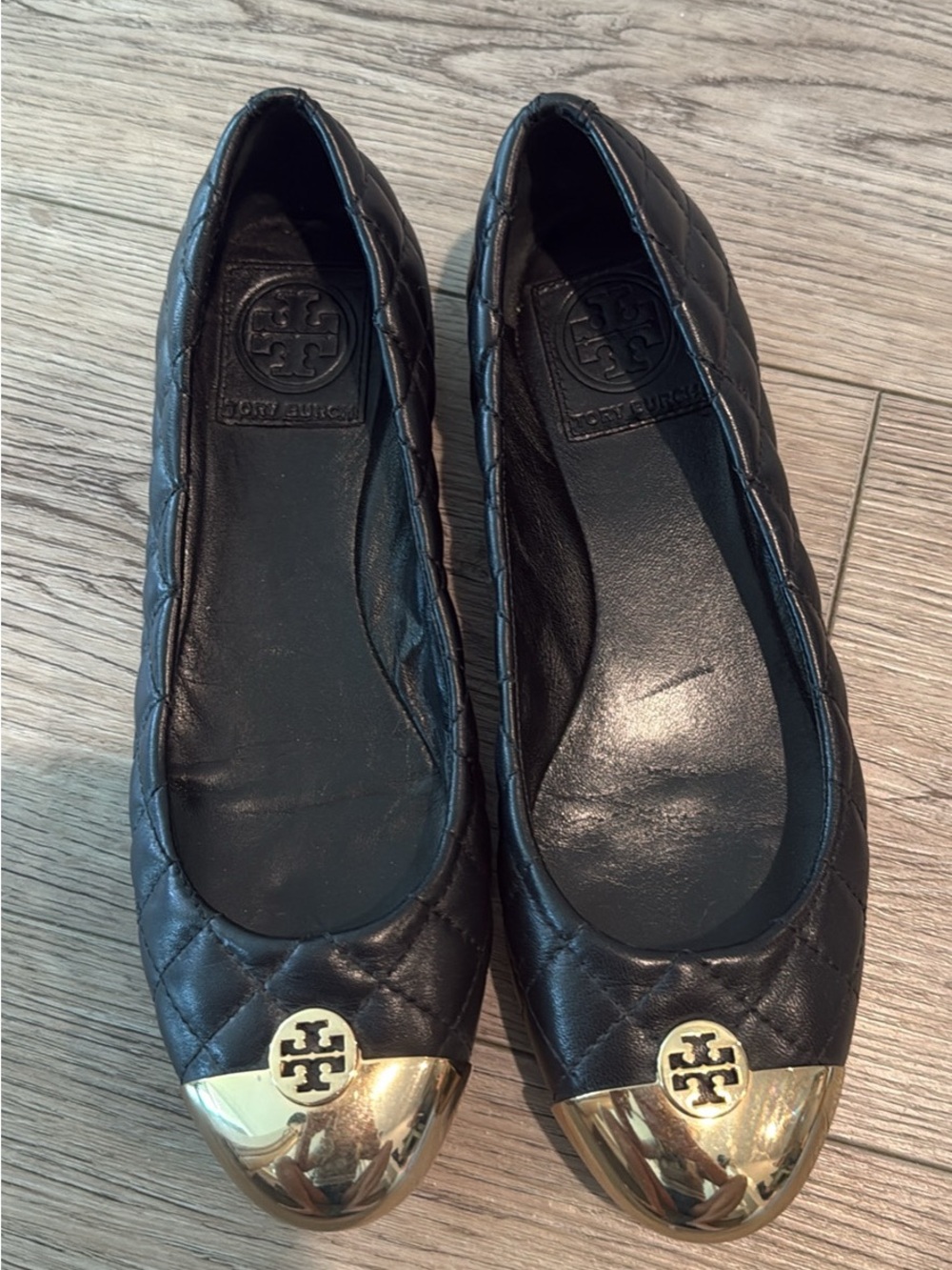 Tory Burch Black Quilted Leather Ballet Flats with Gold Cap Toe Logo